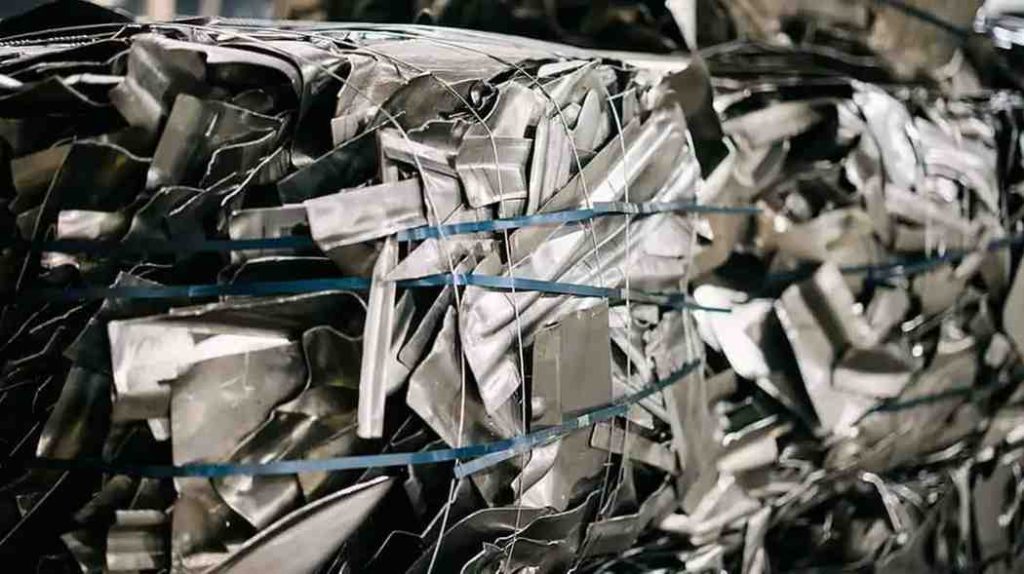 Compressed aluminum and steel scrap ready for recycling.
