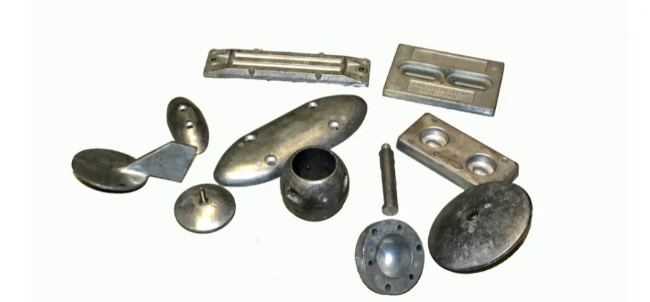 different shaped aluminum parts on a white background