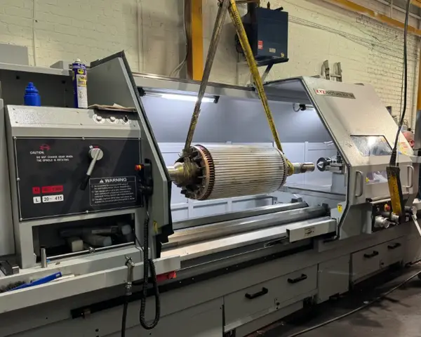 Large CNC lathe machining cylindrical workpiece for the energy industry in a workshop