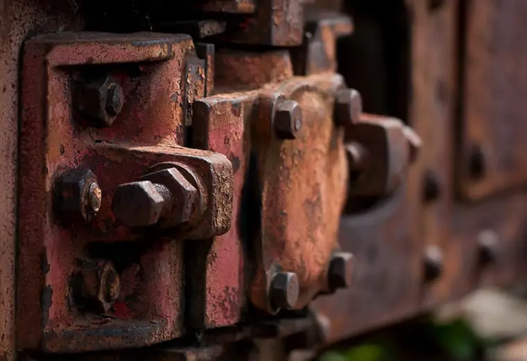 Heavy rust corrosion on industrial metal equipment showing advanced oxidation and structural degradation