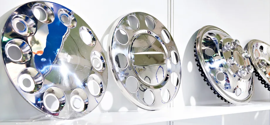 decorative chrome wheels on a white shelf