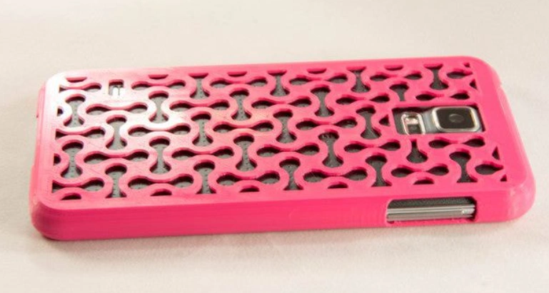 A pink mobile phone case with defined shapes manufactured by FDM printing