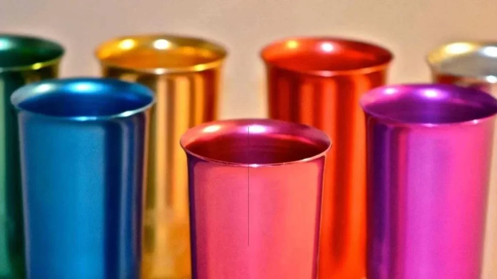An image showing anodized metal products in various colors, all with a smooth and uniform finish. 