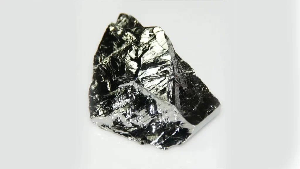 A close-up of a shiny, metallic-looking piece of the element germanium