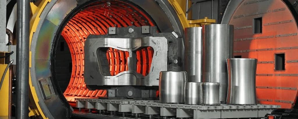 An image showing multiple titanium parts ready to enter the heating chamber for heat treatment 