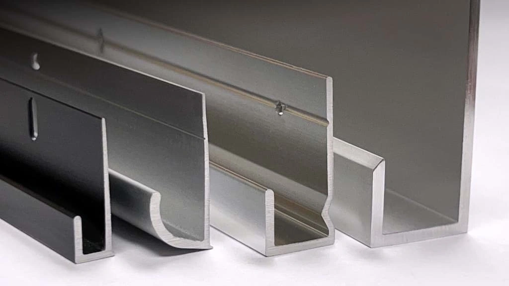 An image showing four J-shaped metal channels in a line