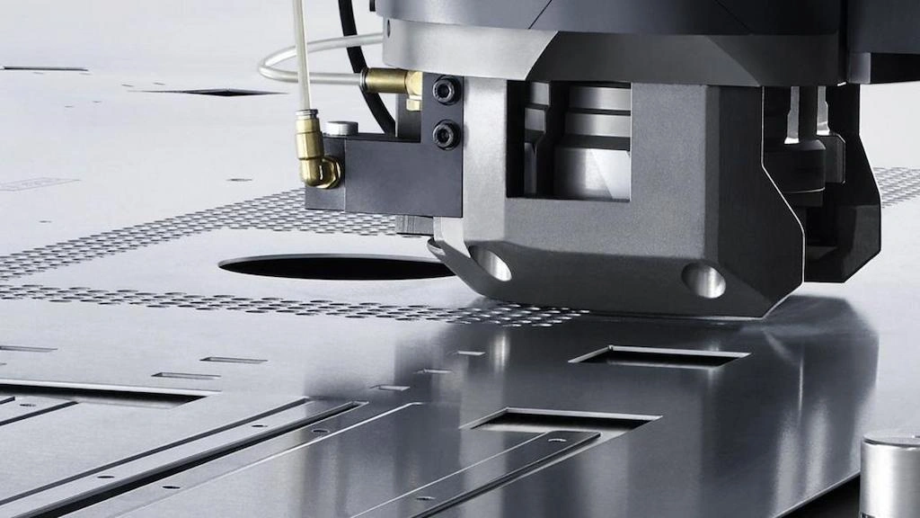 a close-up view of the hole punching process