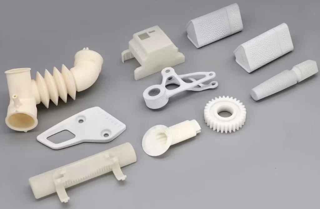 10 plastic prototypes of car parts, including a spur gear