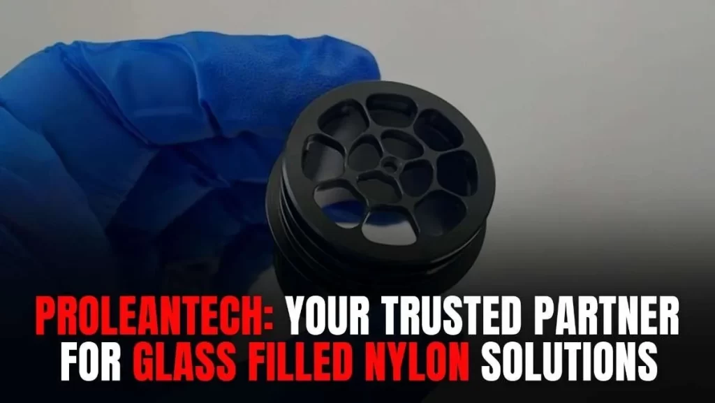 A gloved hand holding a black, intricately designed circular component.