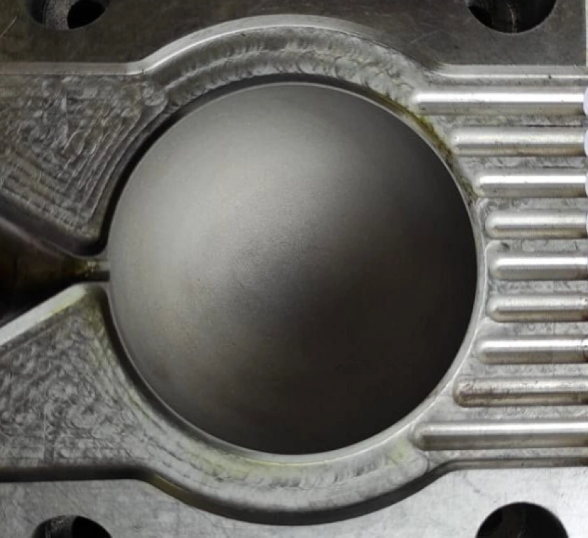 A close-up image of a sand blasting injection molding die surface