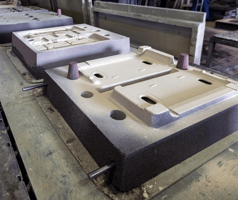 Large Molds used in the metal casting process, showing cavity design for producing metal parts.