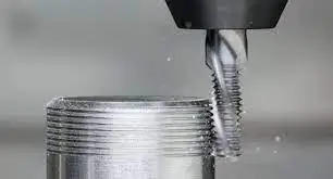 CNC Machining Tool precisely making threads in a workpiece