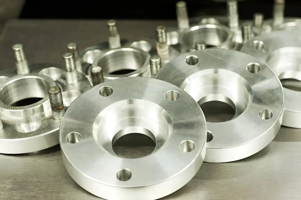 Tool steel machined parts with threaded holes, designed for mounting and assembly.