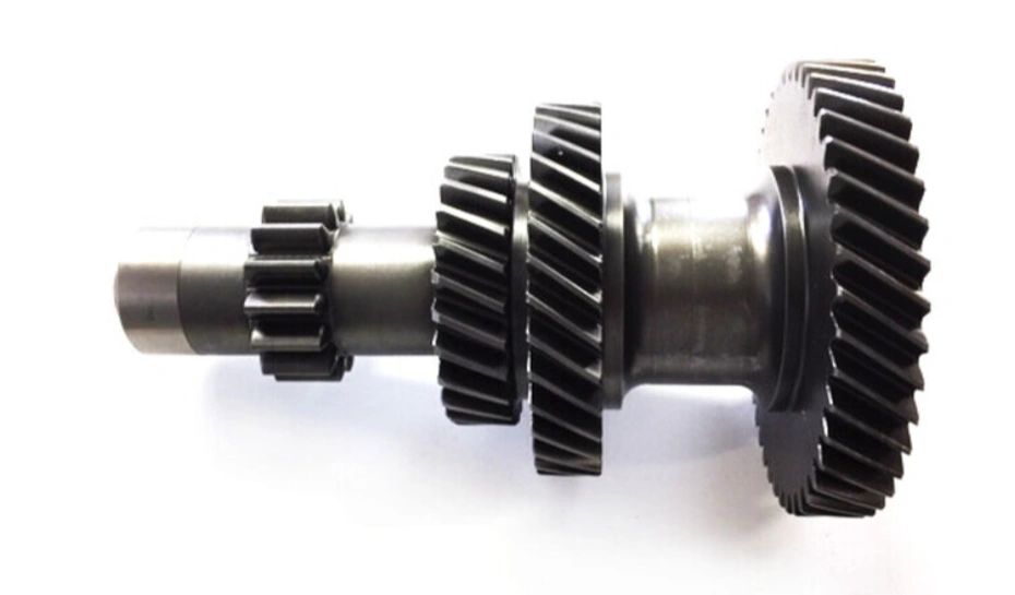 Precision-machined aluminum transmission gear assembly with helical teeth on a white background  