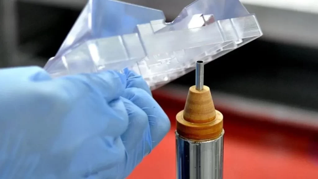 A close-up of a transparent, newly polished plastic part