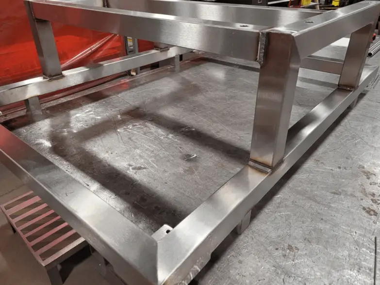 Sheet metal frame with welded corner joints